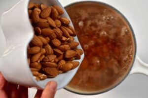 pouring almond into hot boiling water