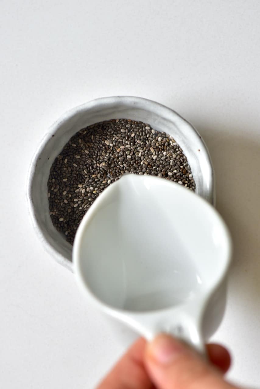 pouring water into the chia seeds