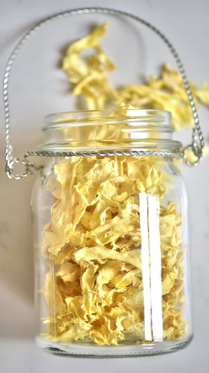 top view of a glass jar containing ginger chips