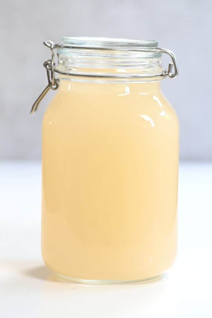 A jar full with homemade apple cider vinegar