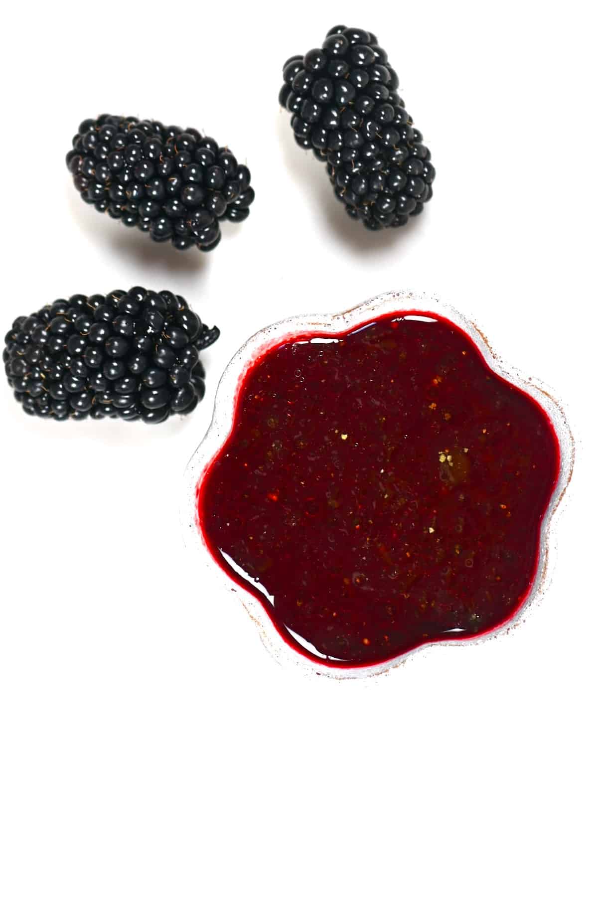 A small bowl with blackberry salad dressing