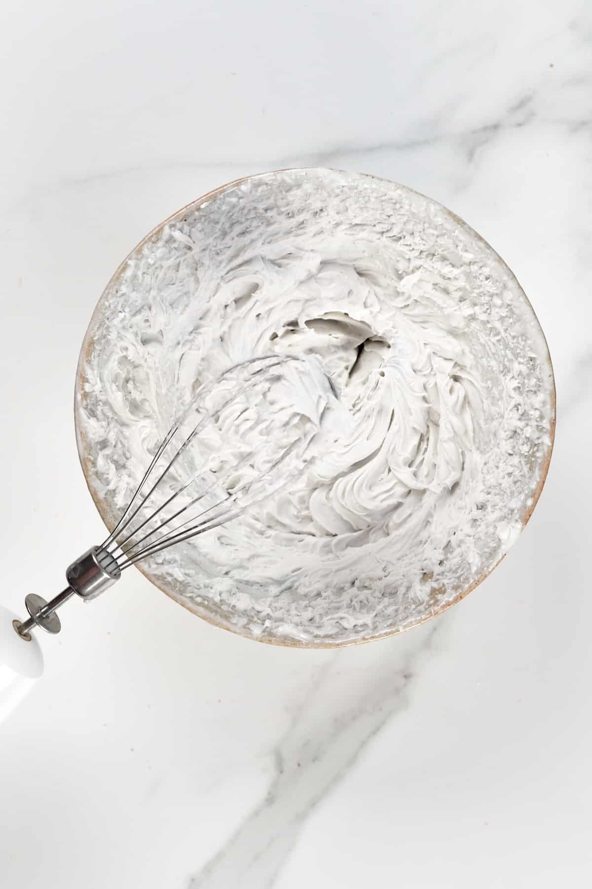 Whipping coconut cream in a bowl
