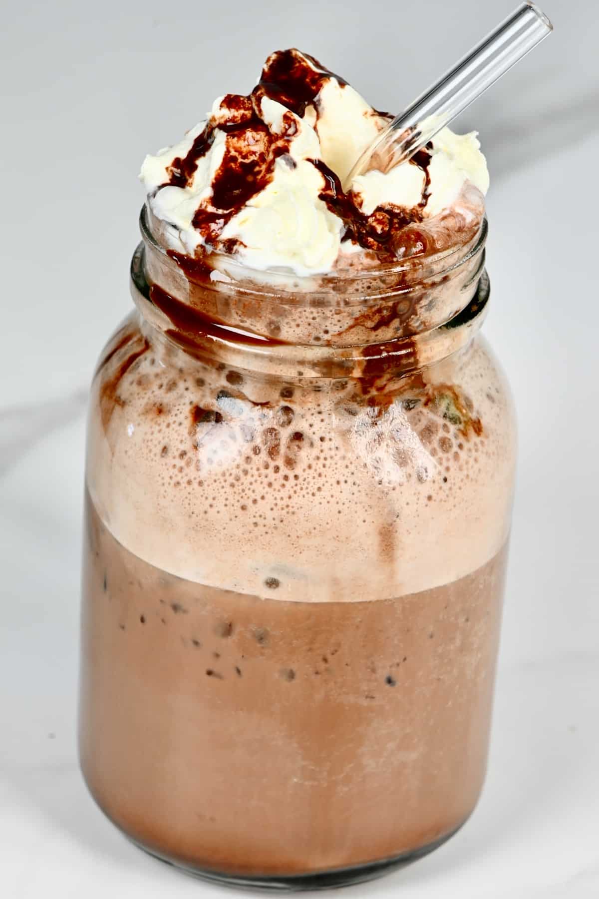 Mocha Frappuccino in a glass with a straw