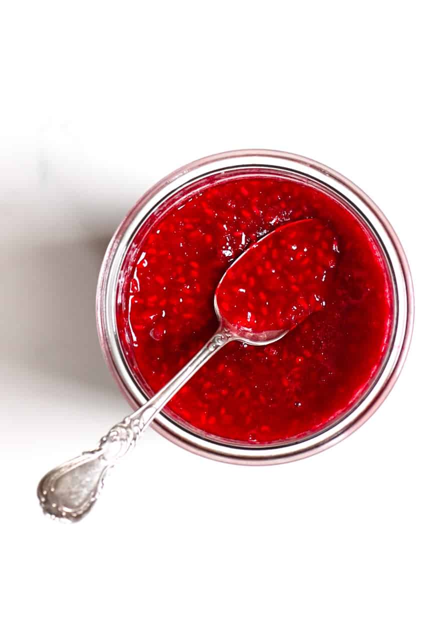 Raspberry Jam in an open glass jar