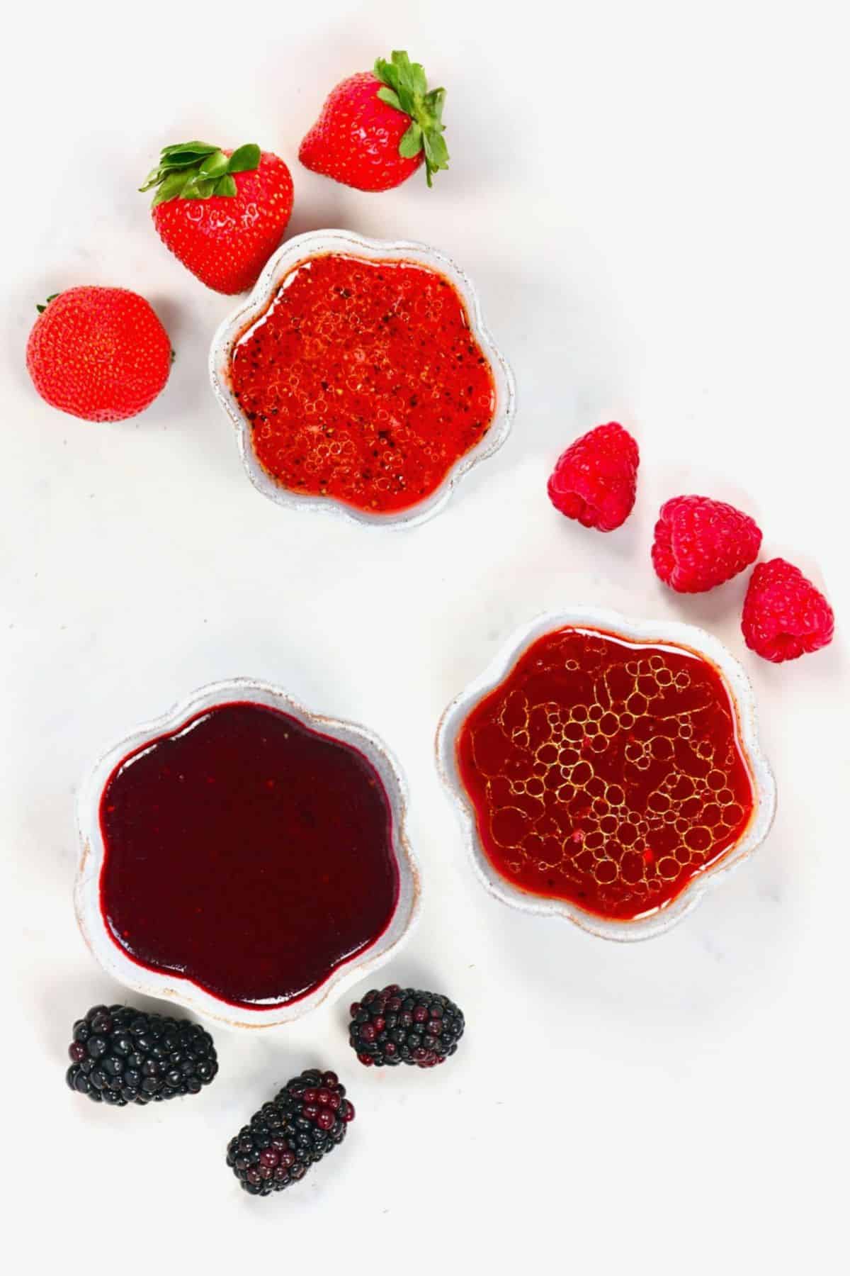 Strawberry Raspberry and Blackberry dressings in small bowls
