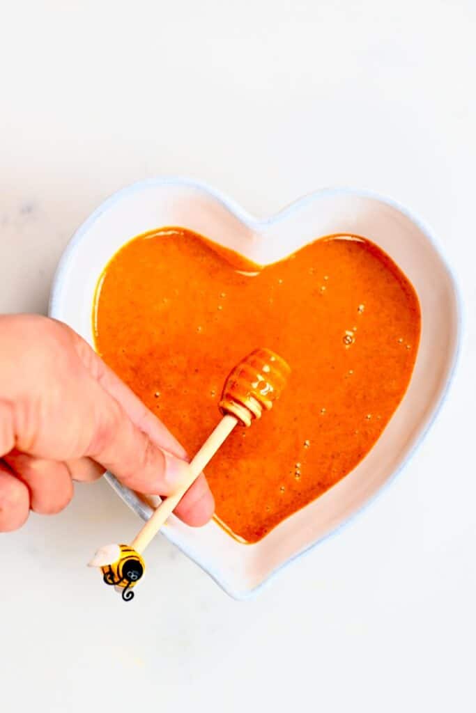 a stick with drizzle of turmeric honey