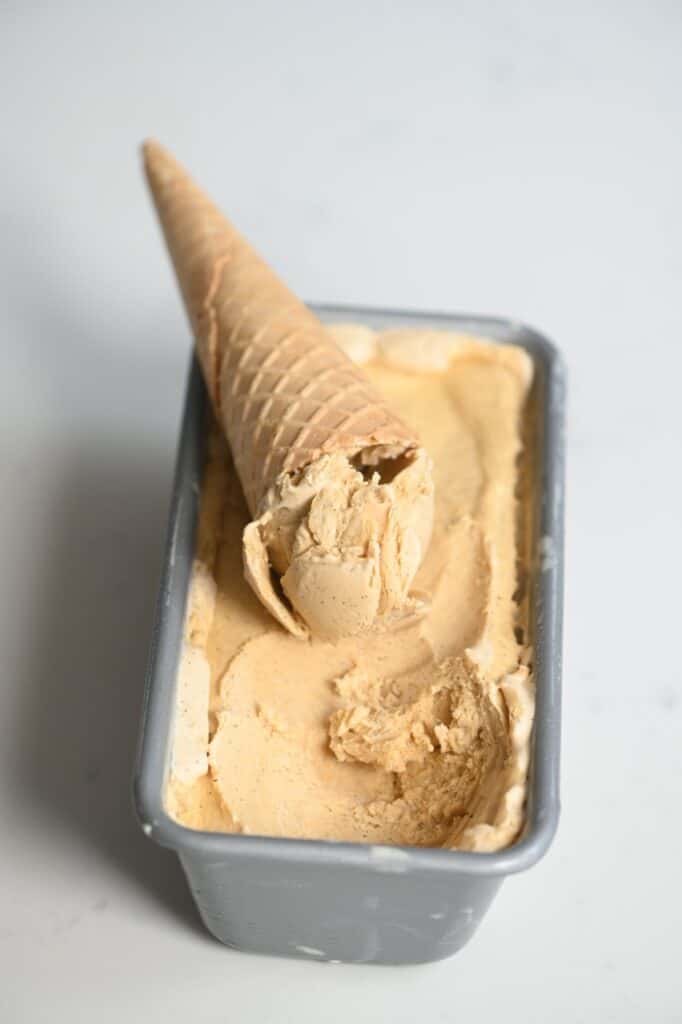 caramel ice cream tub with a waffle cone