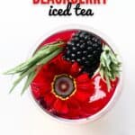 Top view of Blackberry Iced Tea with a blackberry edible flower and rosemary