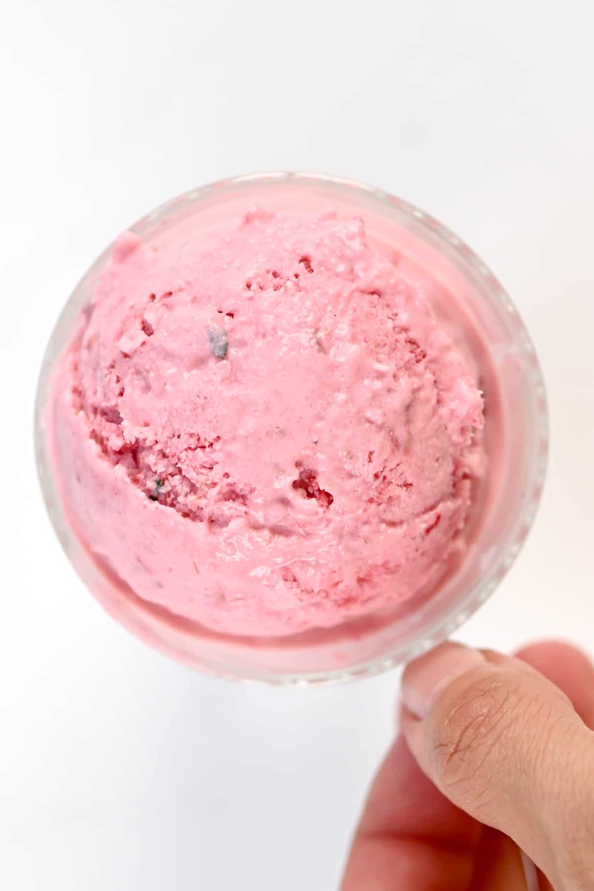 Close up of a scoop of Raspberry Ice Cream in a glass cup