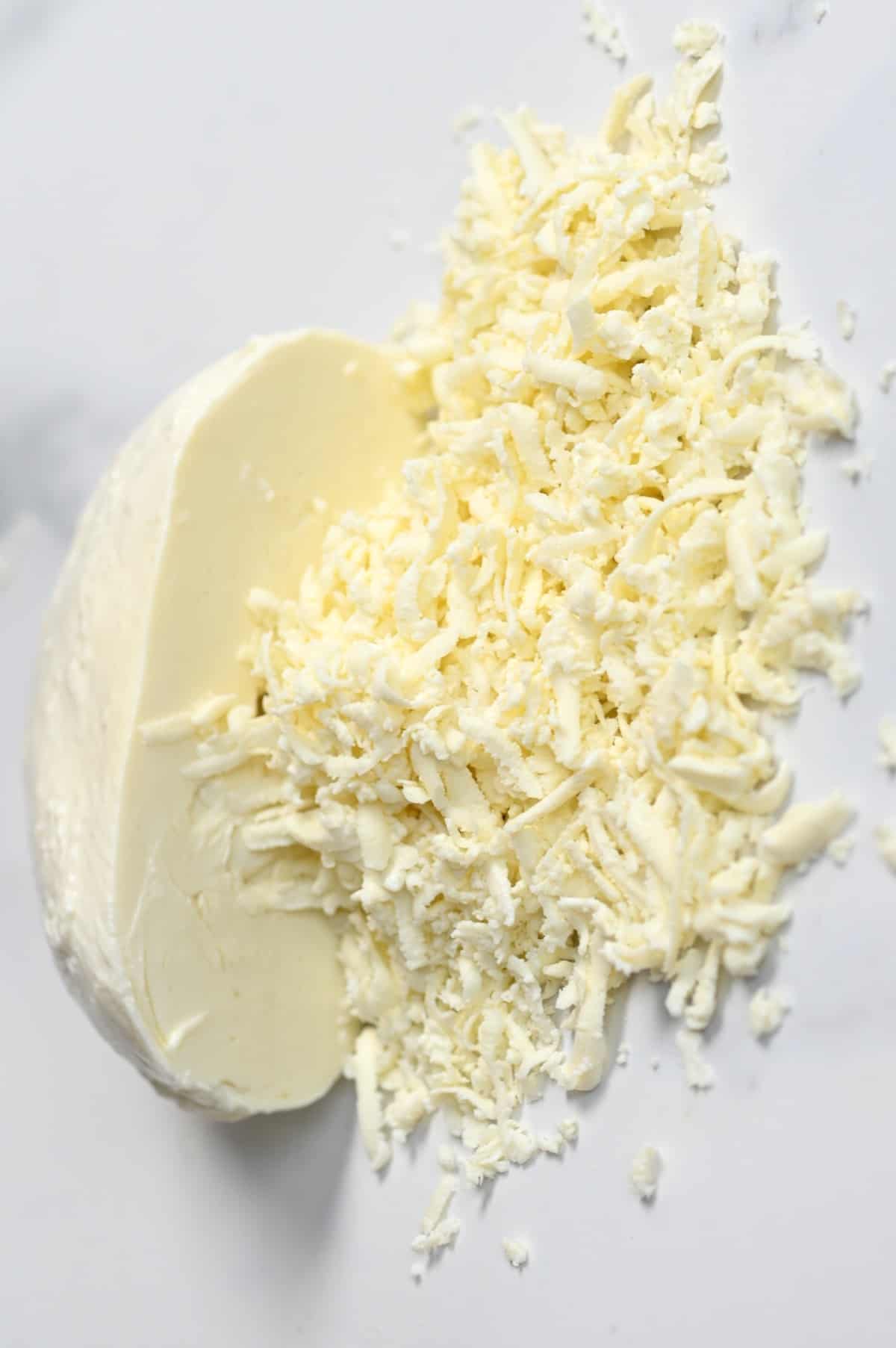 Half-grated homemade mozzarella cheese