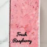 Raspberry ice cream in a tun before freezing