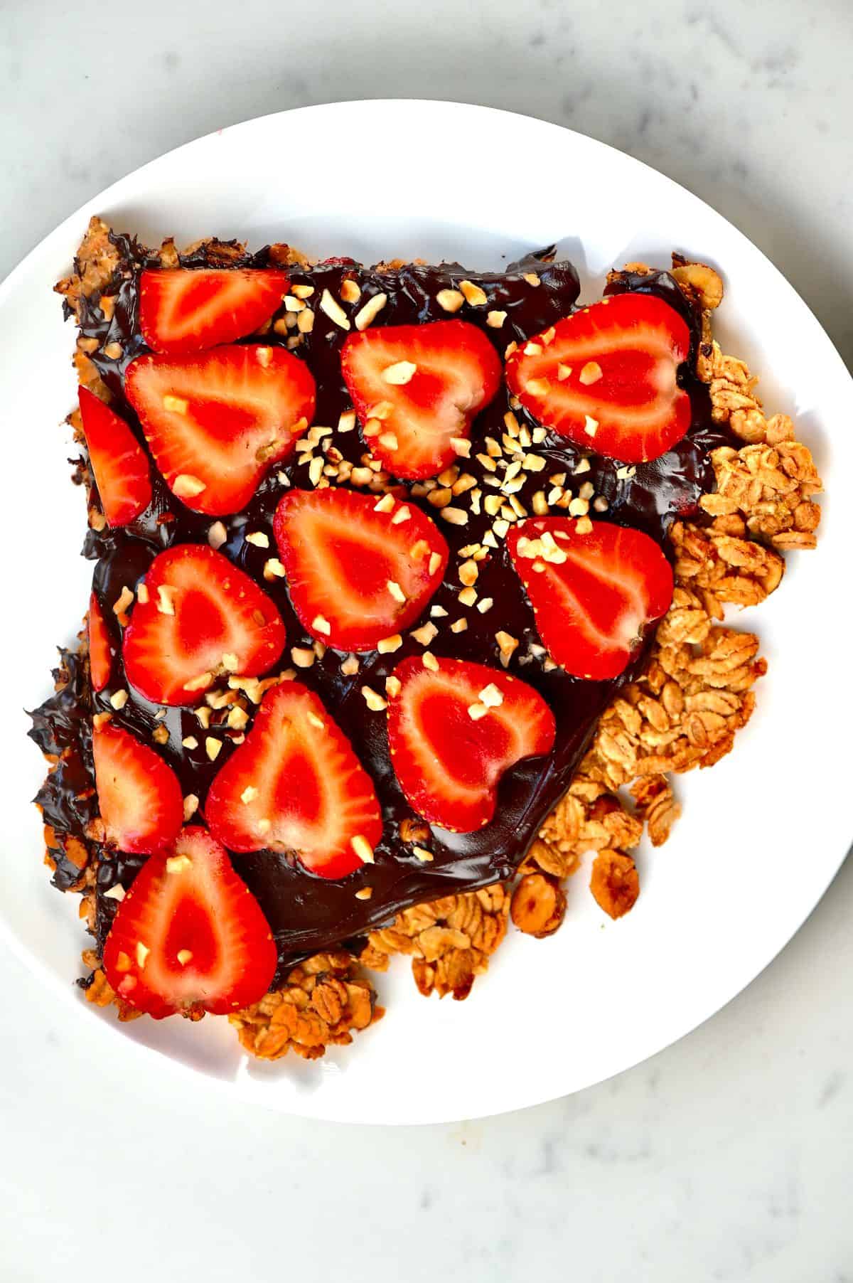 Slice of Strawberry Nutella pizza on a white plate