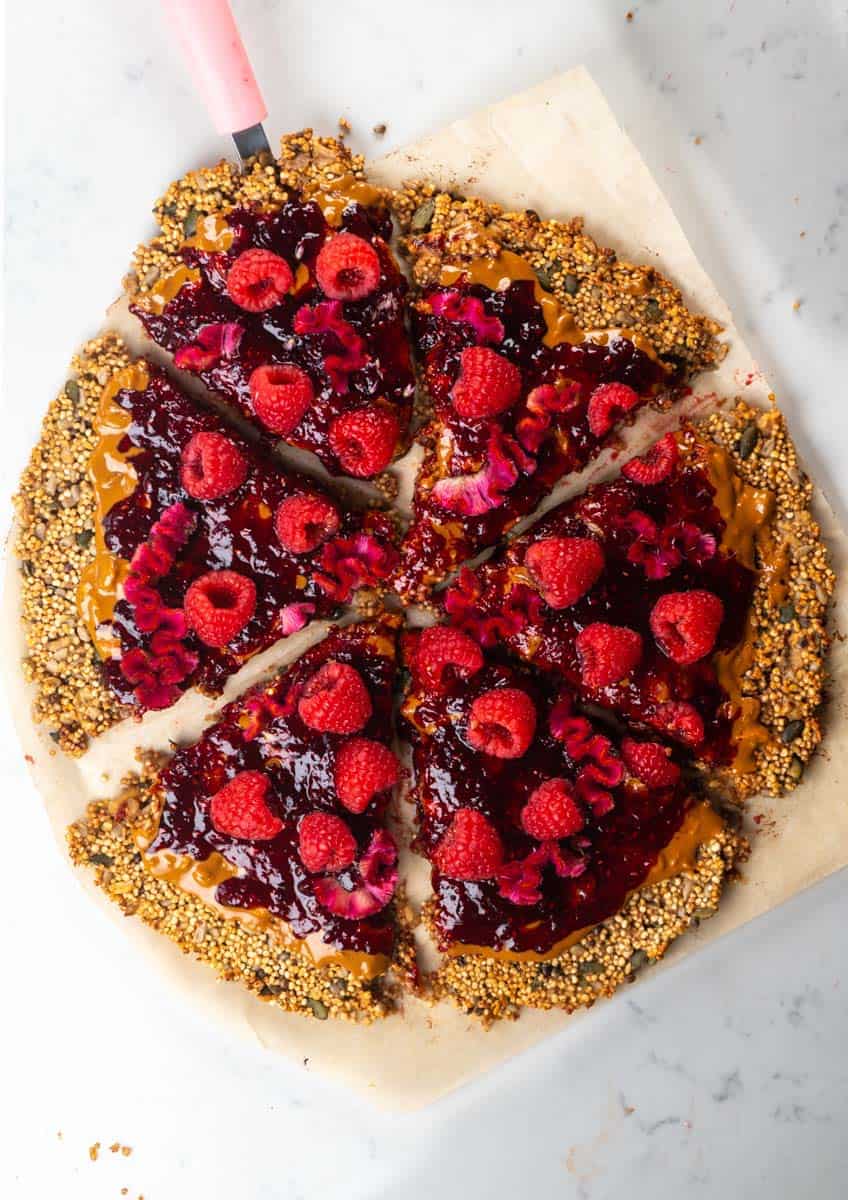 raspberry peanut butter raspberry jelly pizza cut into six slices
