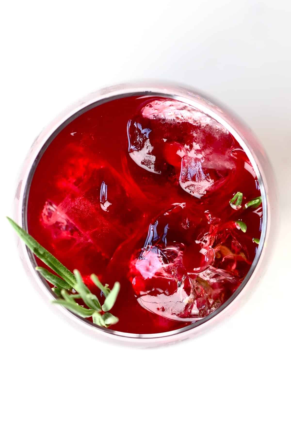 top view of a glass of blackberry iced tea with ice