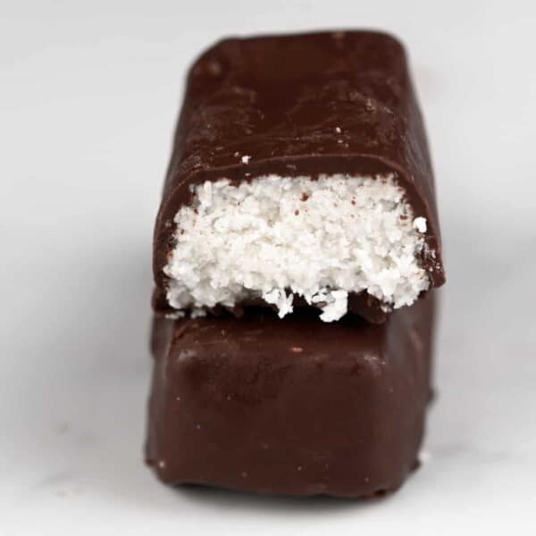 Half eaten bounty bar on top of a whole one