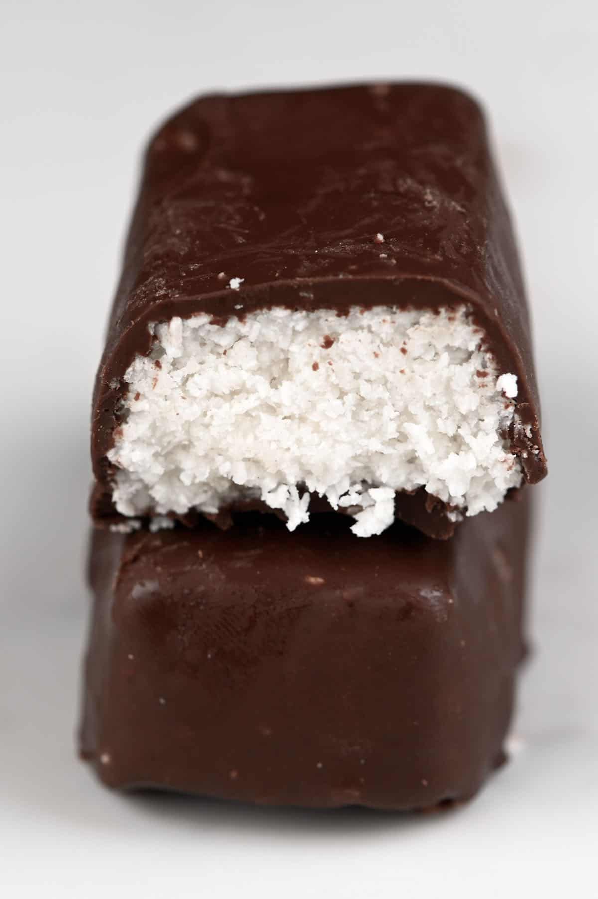 A half eaten bounty bar placed on top of another