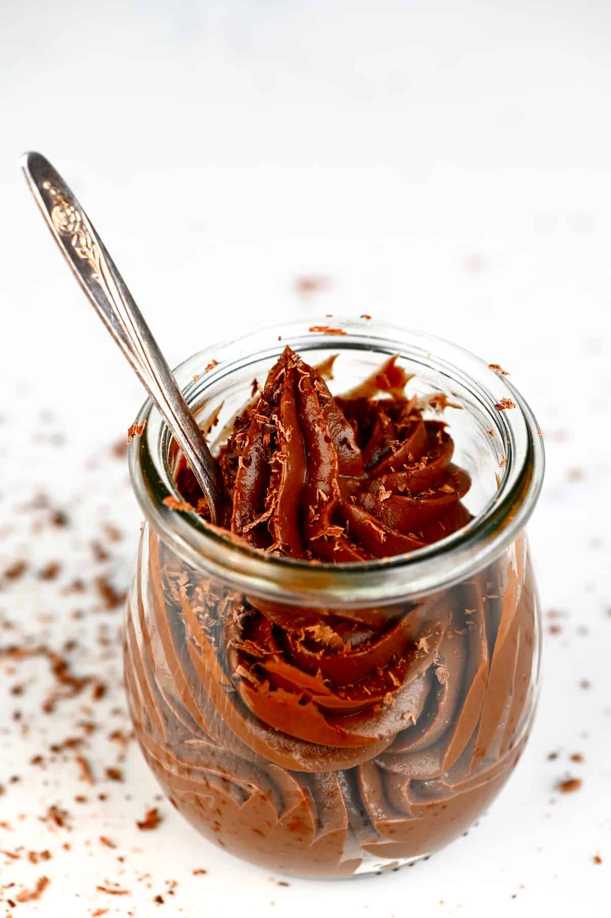 A little jar with Chocolate Pastry Cream and a spoon