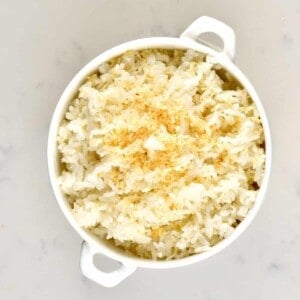 A small white bowl with coconut rice