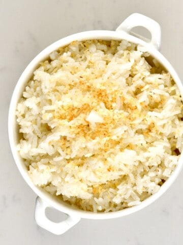 A small white bowl with coconut rice