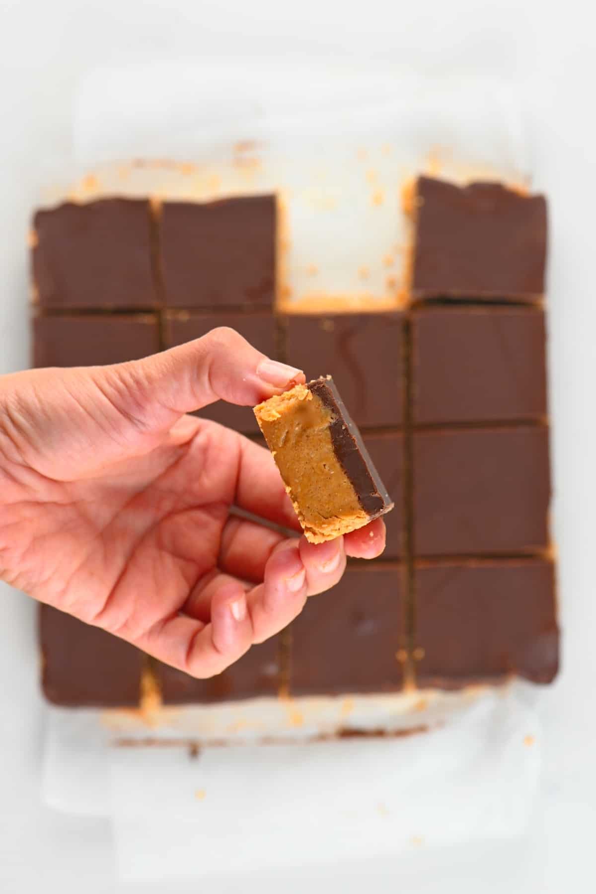 A close up of a square of peanut butter bar