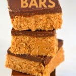 Squares of Peanut Butter Bars stacked on top of each other