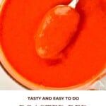 A close up of Roasted Red Pepper Sauce with a spoonful of the sauce