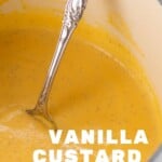 Close up of Vanilla Custard in a pot with a spoon