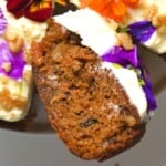 A close up of carrot cake slice with cream cheese frosting