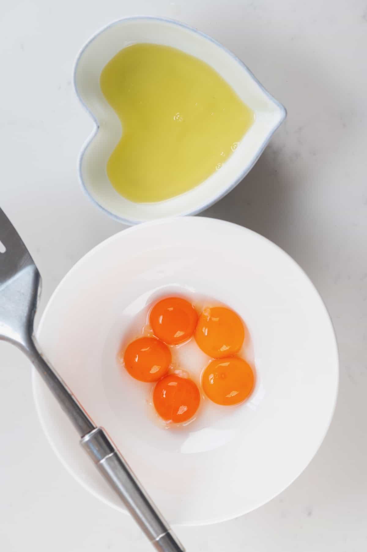 how to separate egg whites and yolks use slotted spoon. one bowl with whites and one with yolks. 