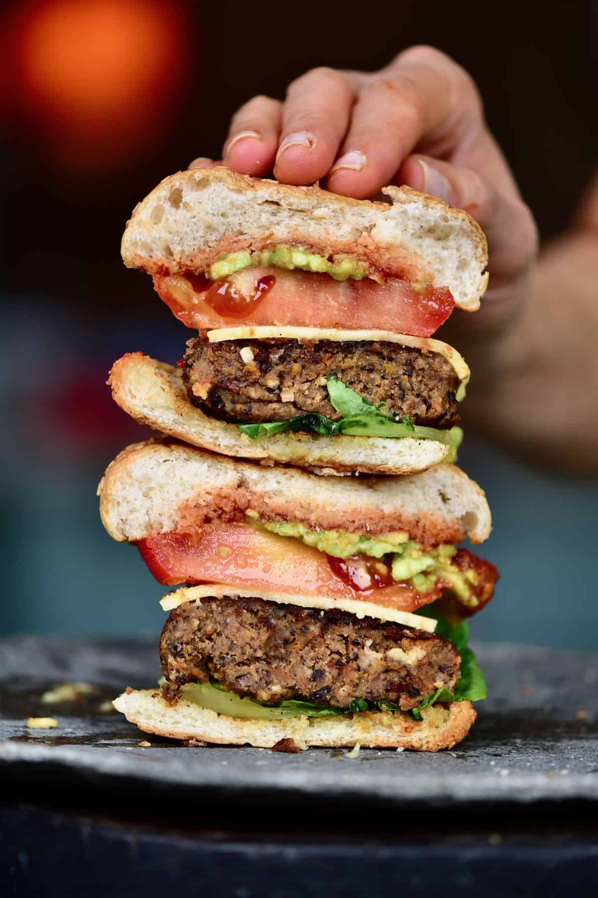 Two halves of Sweet Potato Black Bean Burger stacked on top of each other