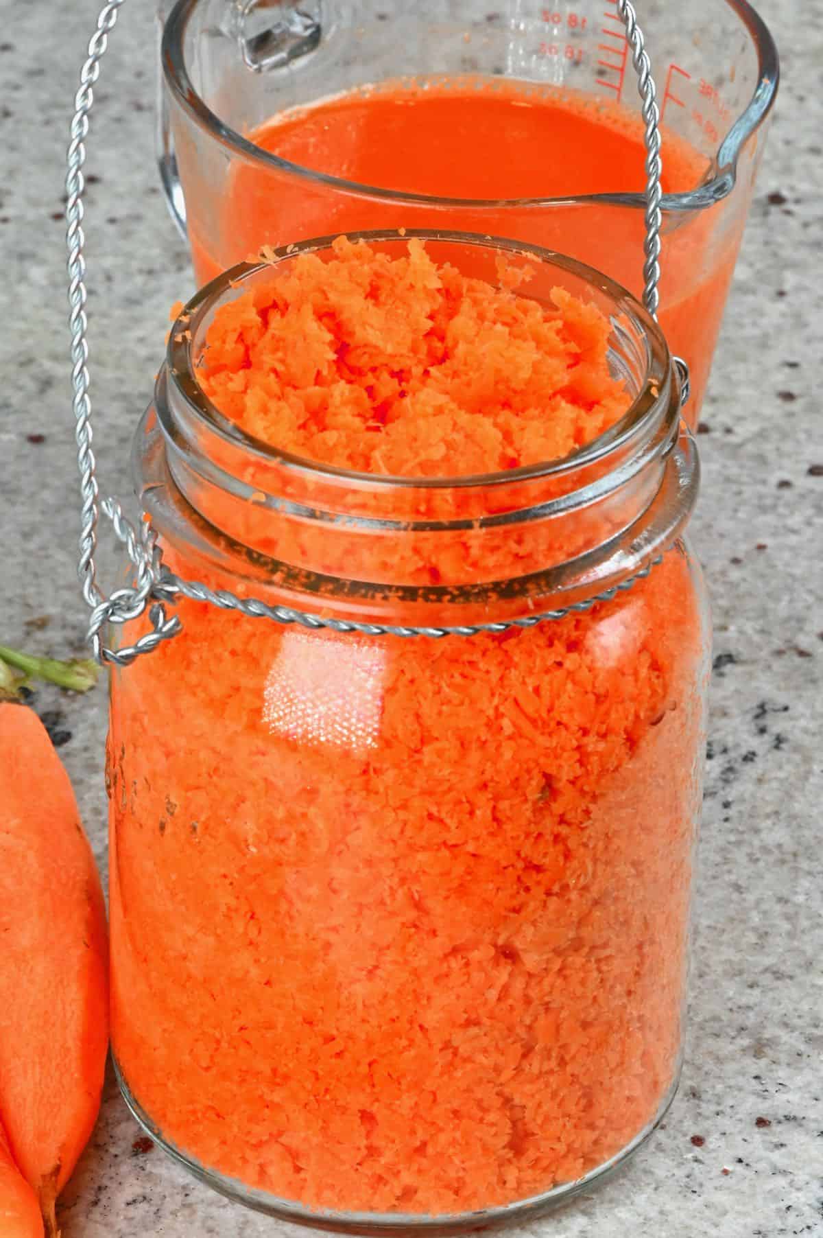 Carrot juice leftover pulp in a container