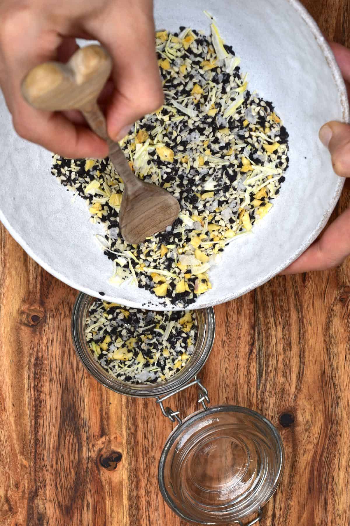Filling up a jar with Everything Bagel Seasoning