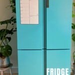 A fridge freshly painted in turquoise