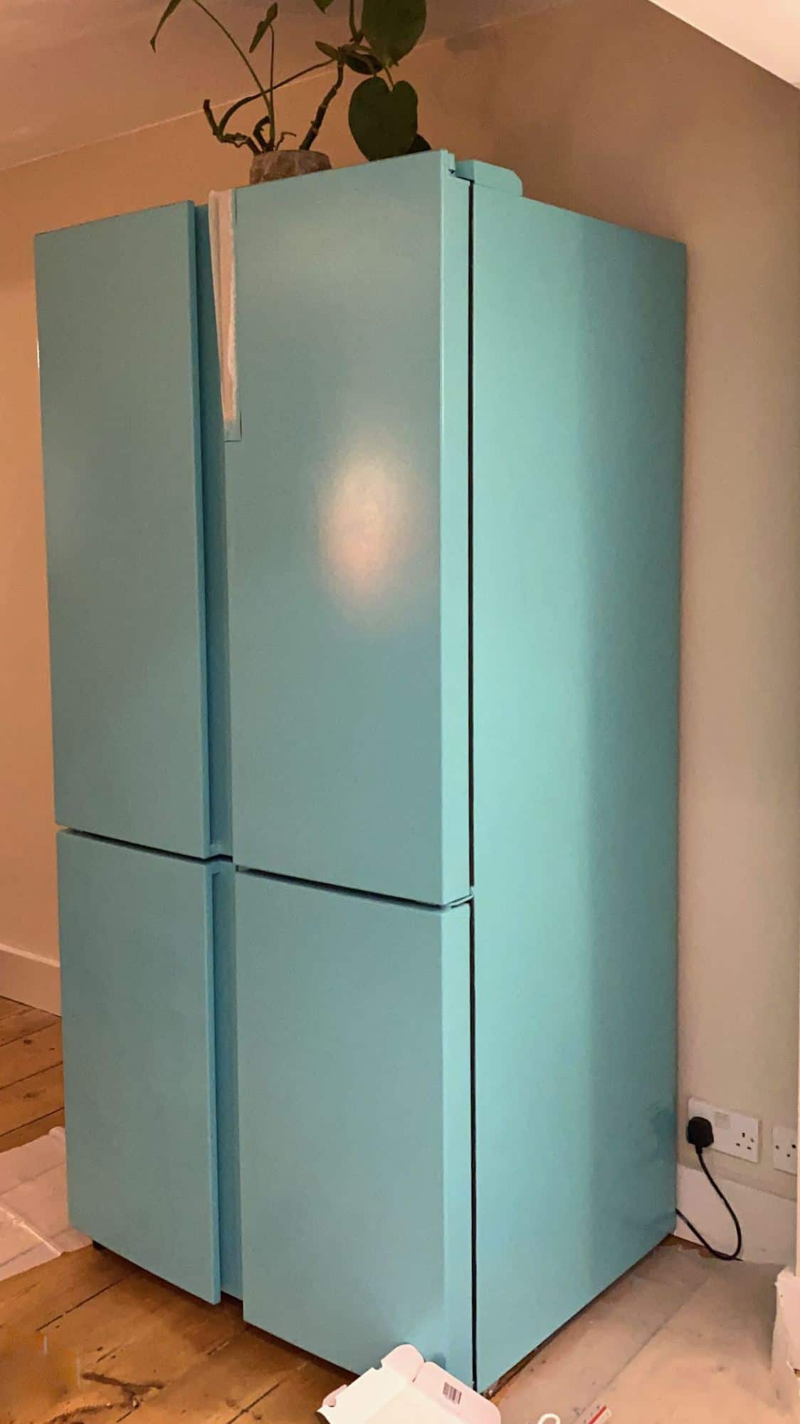 A multi-door fridge freezer freshly painted in turquoise. retro refrigerator on a budget