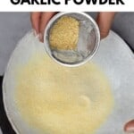 Sieving garlic powder in a bowl