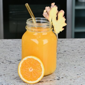A glass of orange ginger juice