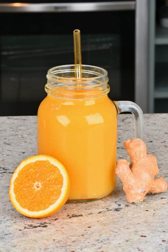 Orange ginger juice in a mason jar