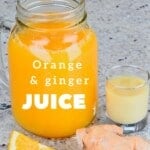 A mason jar with Orange Juice and a small glass with ginger juice