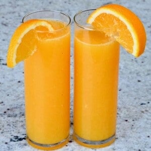 Two glasses with orange juice