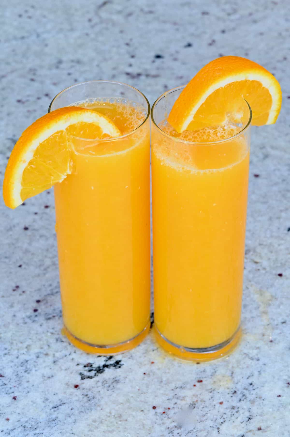 Two glasses with orange juice