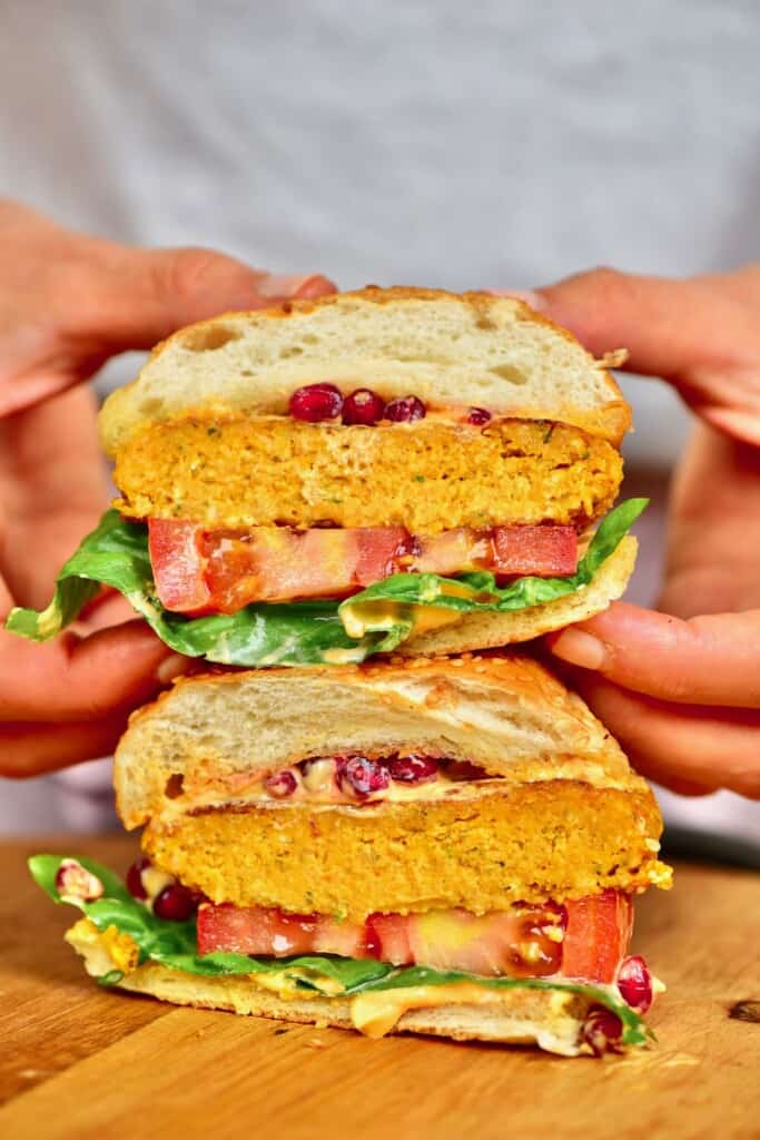 Two halves of a pumpkin patty burger stacked on top of each other