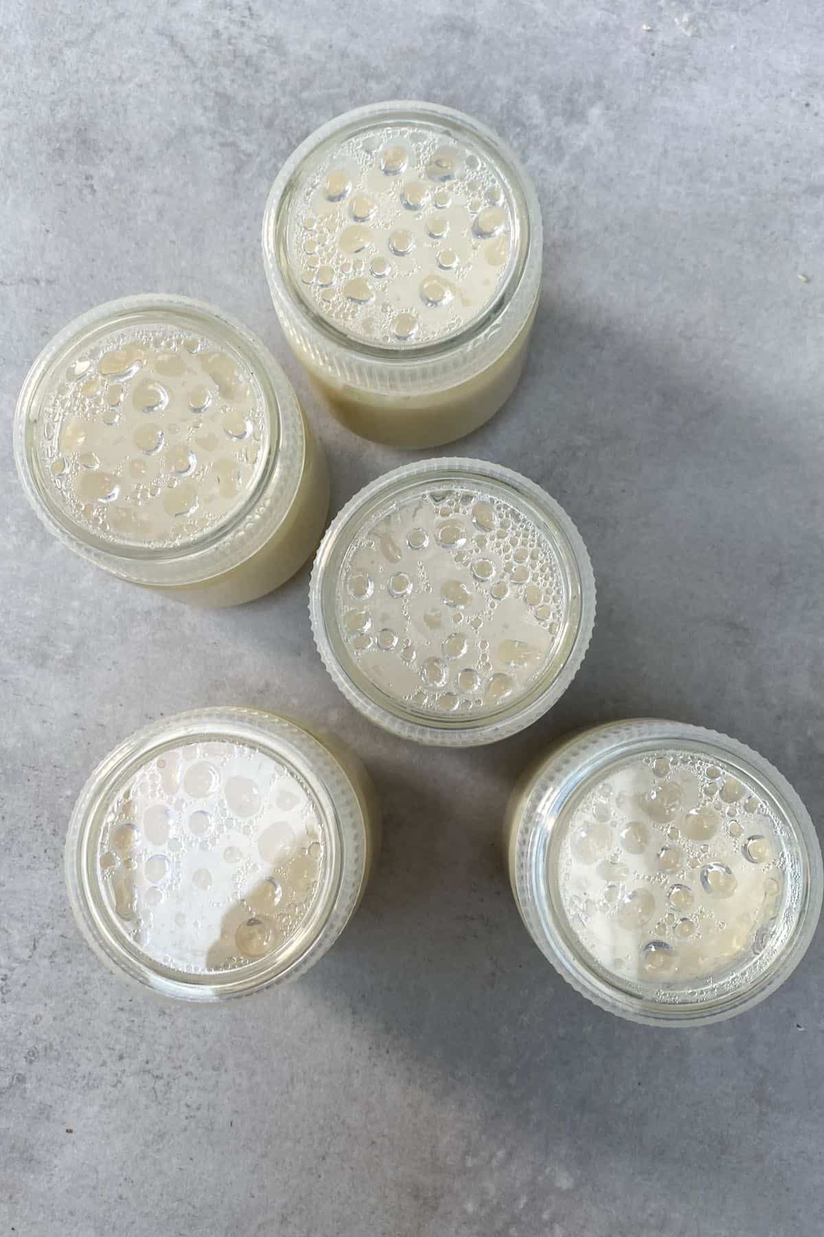 Five little jars with soy yogurt