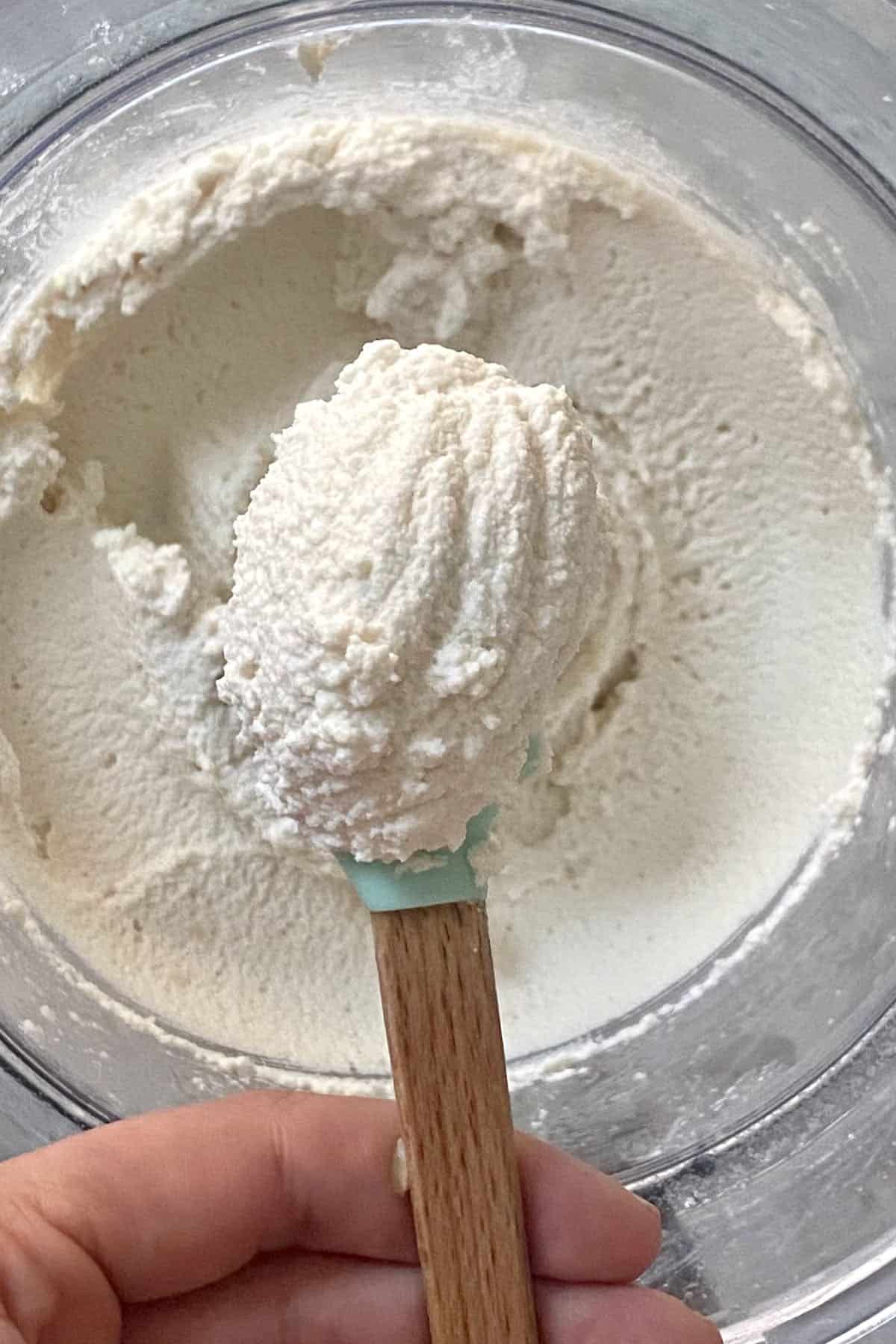 A spoonful of creamy vegan almond ricotta