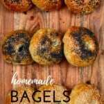 Nine homemade bagels with different toppings lined up in a wooden board