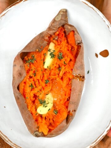 Baked sweet potato with some butter and thyme