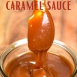 A spoonful dripping caramel sauce into a jar
