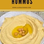 Hummus in a bowl topped with chickpeas