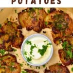 Smashed potatoes and a bowl of white sauce