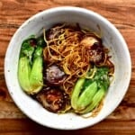Dan dan noodles with bok choy and mushrooms in a bowl - 15