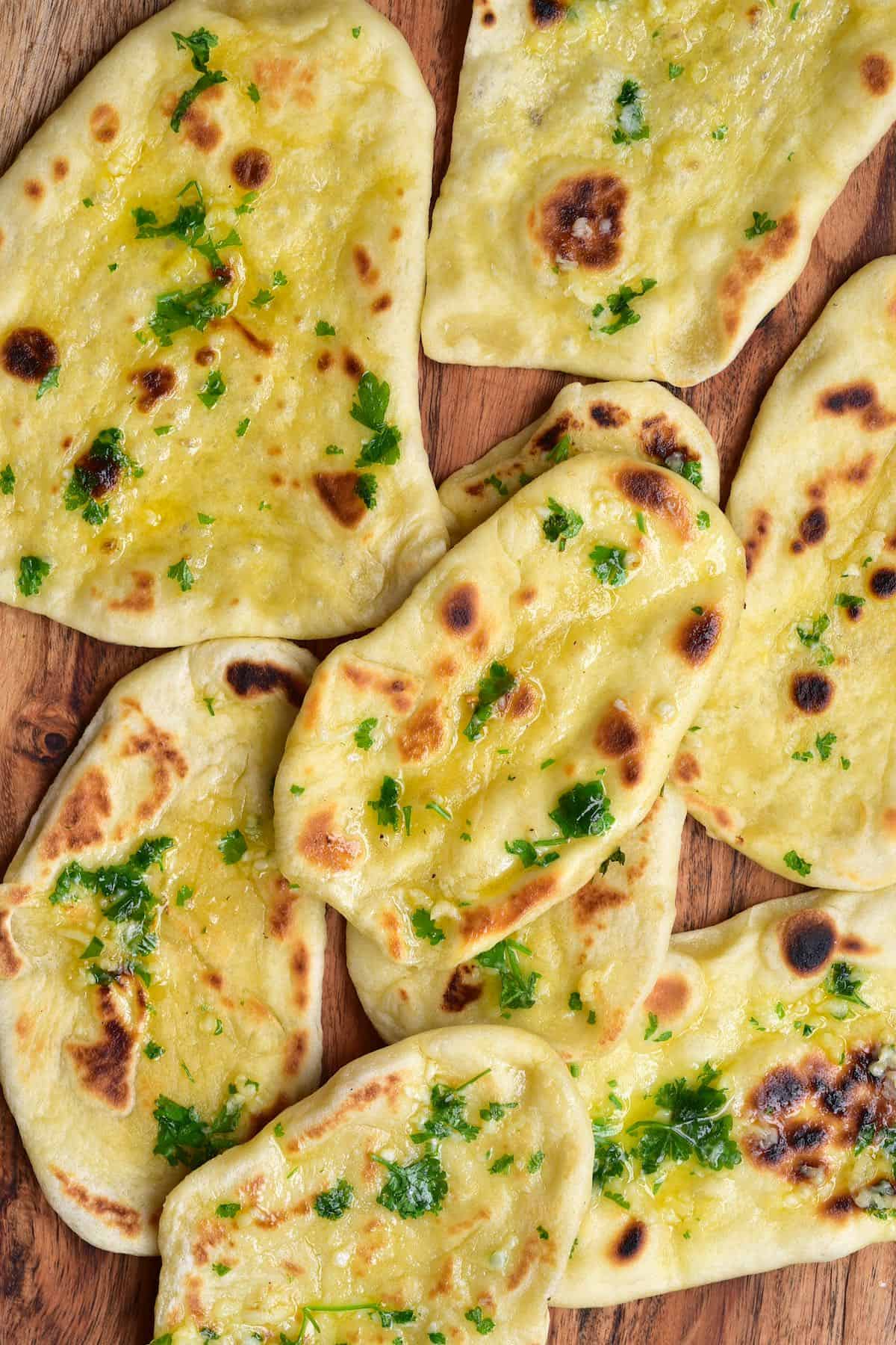 A few naan breads on a flat surface